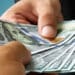 Dólar cai a R$ 5,11 e Bolsa sobe após Fed e mudança de perspectiva de crédito do Brasil